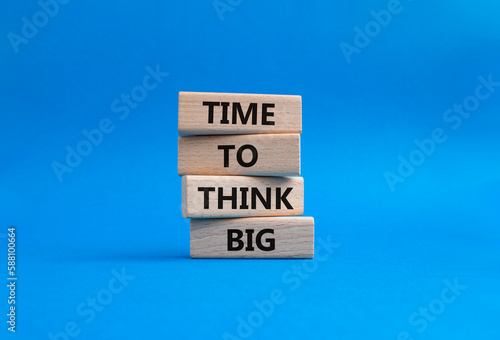 Time to think big symbol. Wooden blocks with words Time to think big. Beautiful blue background. Business and Time to think big concept. Copy space.