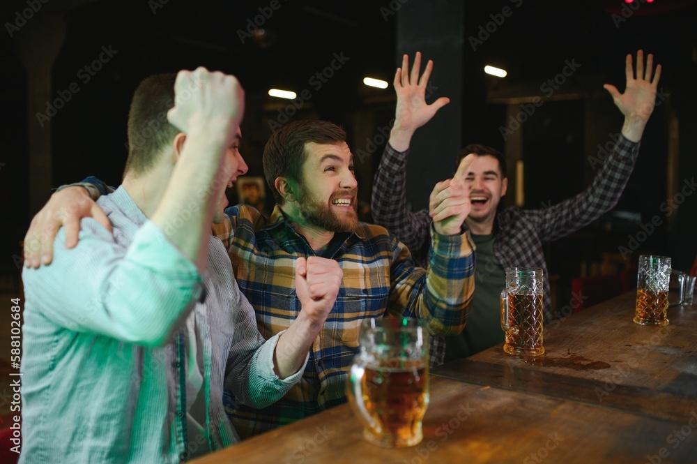 Soccer fans cheering for favourite team while enjoying drinks. Group of ...