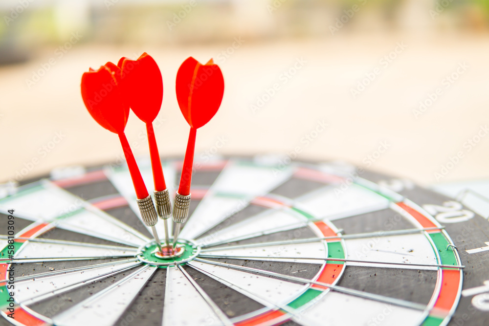 red three darts in target center target business concept
red three darts in target center target business concept
