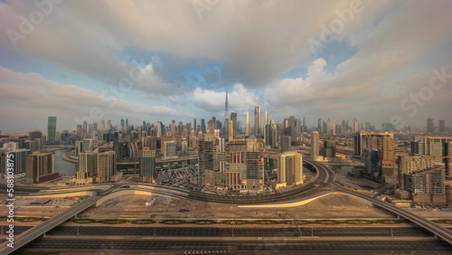 Panoramic skyline of Dubai with business bay and downtown district morning timelapse.