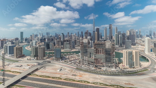 Panorama showing skyline of Dubai with business bay and downtown district timelapse.