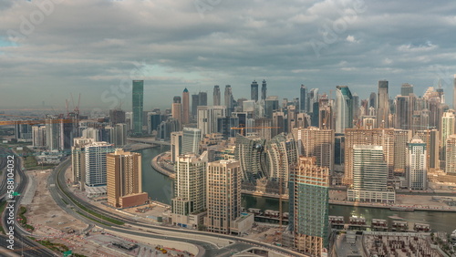 Skyline with modern architecture of Dubai business bay towers morning timelapse. Aerial view © neiezhmakov