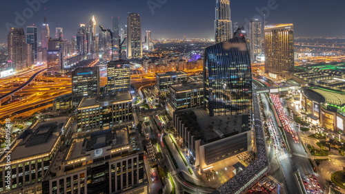 Futuristic Dubai Downtown and finansial district skyline aerial day to night timelapse.