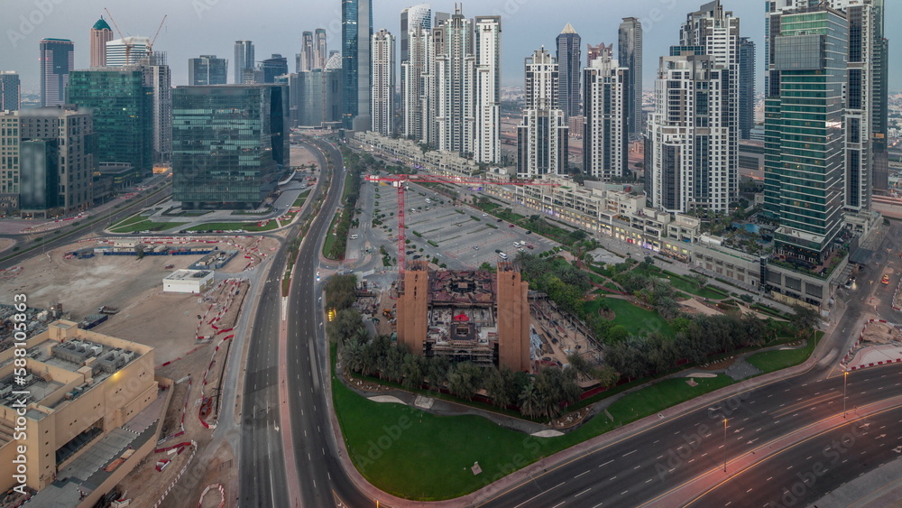 Bay Avenue with modern towers residential development in Business Bay aerial panoramic night to day timelapse, Dubai Bay Avenue with modern towers residential development in Business Bay aerial panoramic night to day timelapse, Dubai