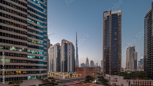 Aerial panoramic view to Dubai downtown and difc skyscrapers day to night timelapse. © neiezhmakov