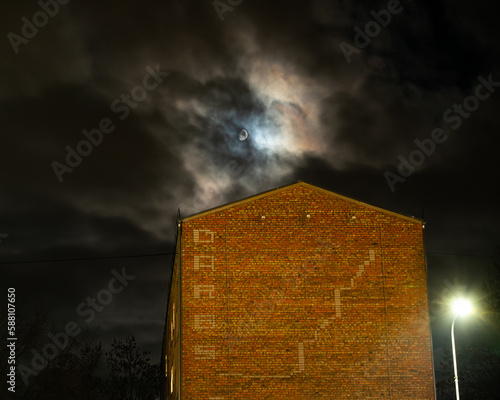 Moon behind the cloud in the night