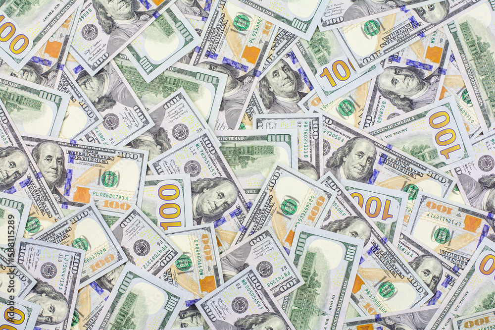 Pile of US hundred dollar bills as a background Pile of US hundred dollar bills as a background