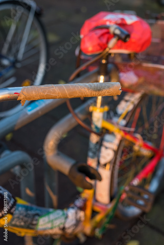Temporary handle on the handlebar of a worn bike photo