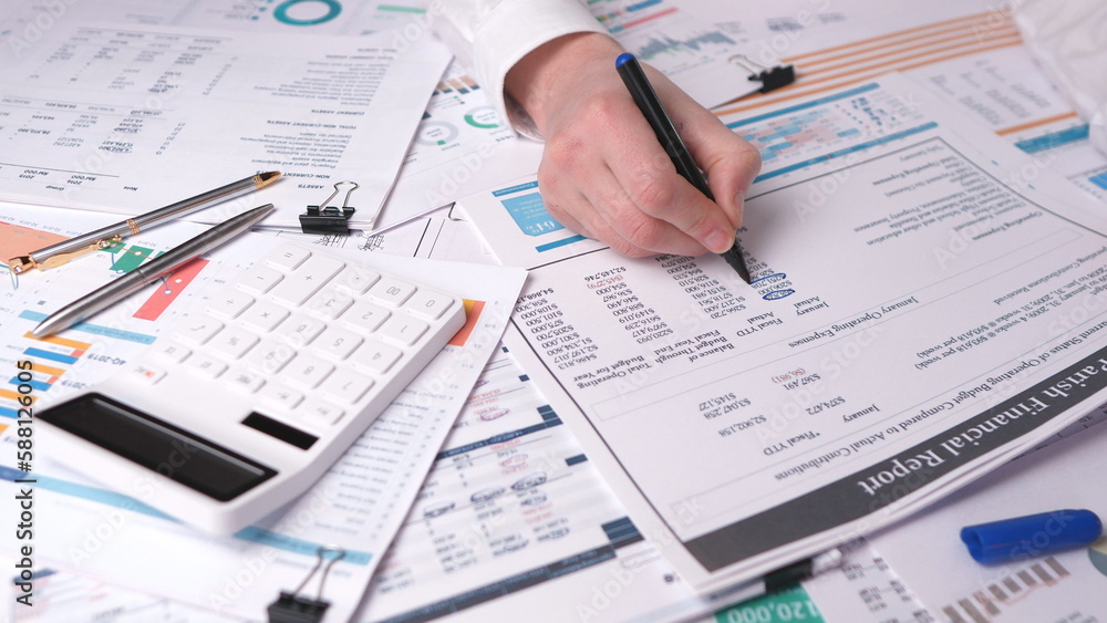 Manager checking the annual financial report Manager checking the annual financial report