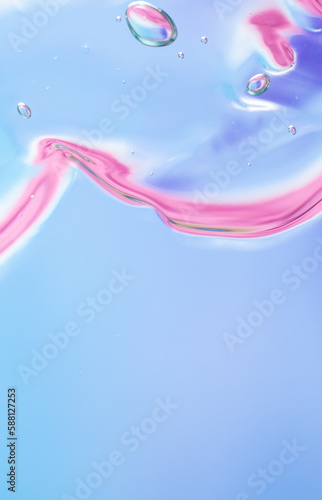 Gel texture of cosmetic products. Pink blue translucent skin care cream with bubbles. macro photo