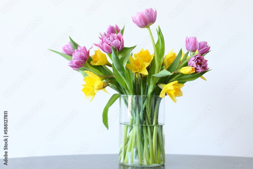 Tulips and narcissus in vase, home decor