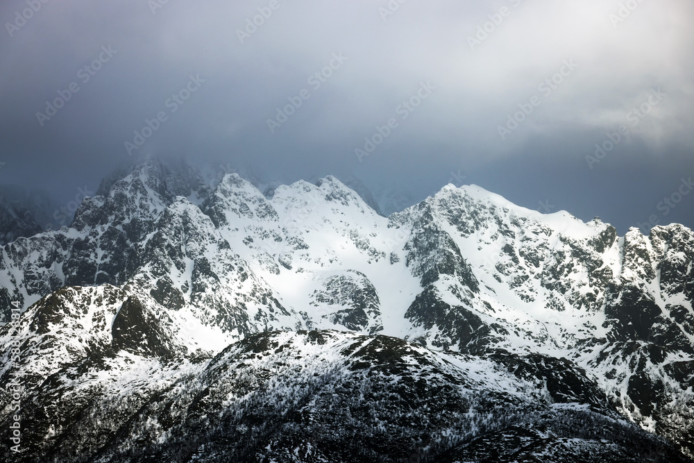 Winter stormy landscape over Lofoten archipelago mountains, Norway, Europe
