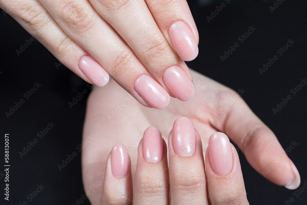 Nail design. Pink manicure with gel polish close-up Nail design. Pink manicure with gel polish close-up