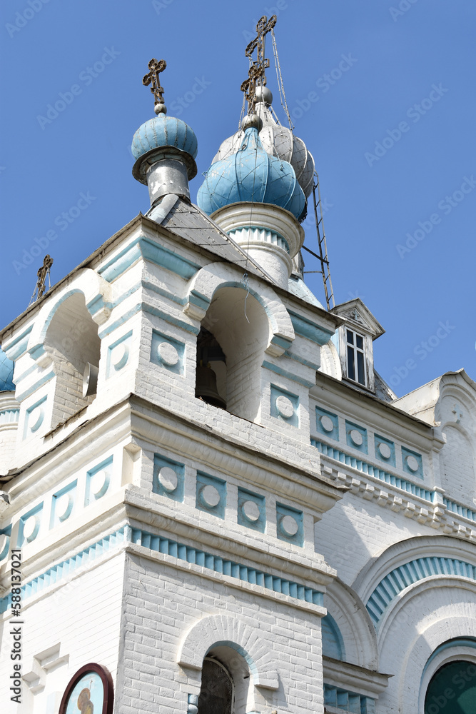 Fototapeta premium Ancient orthodox temple blue sky background