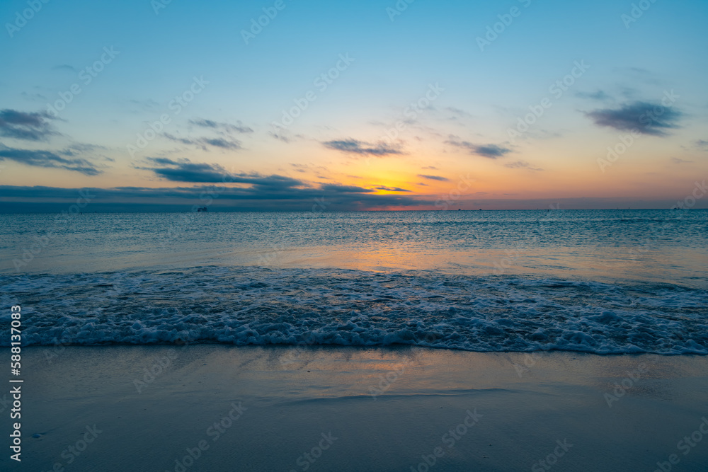 beautiful twilight with sea water on the summer beach