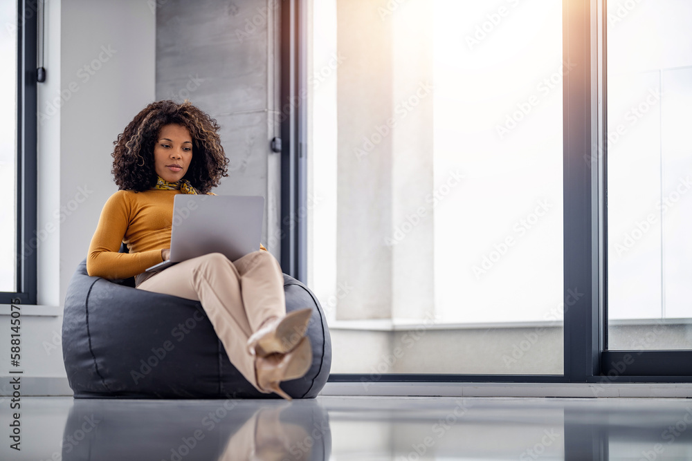 Shot of young entrepreneur woman working with laptop in the office Shot of young entrepreneur woman working with laptop in the office