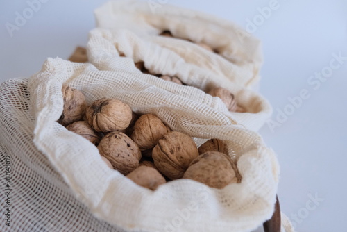 Three cloth bags full of shelled walnuts concept photo idea. 