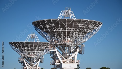 Two radio telescope antennas, near Narrabri NSW, of Australia Telescope Compact Array,observe star formation, the late stages of stars lives, supernovae and magnetic fields. photo