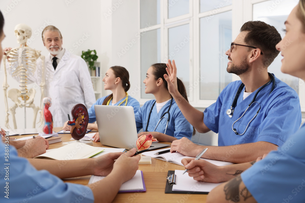 Doctor giving lecture for interns in university Doctor giving lecture for interns in university