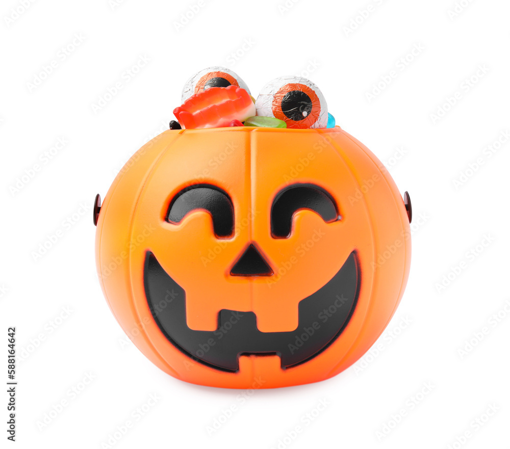 Fototapeta premium Halloween trick or treat bucket with different sweets on white background