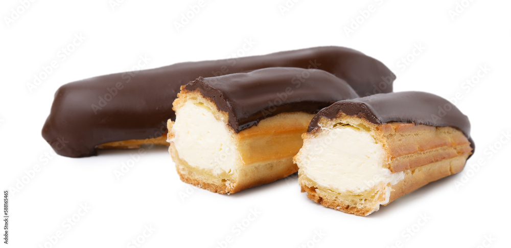 Cut and whole delicious eclairs covered with chocolate isolated on white Cut and whole delicious eclairs covered with chocolate isolated on white