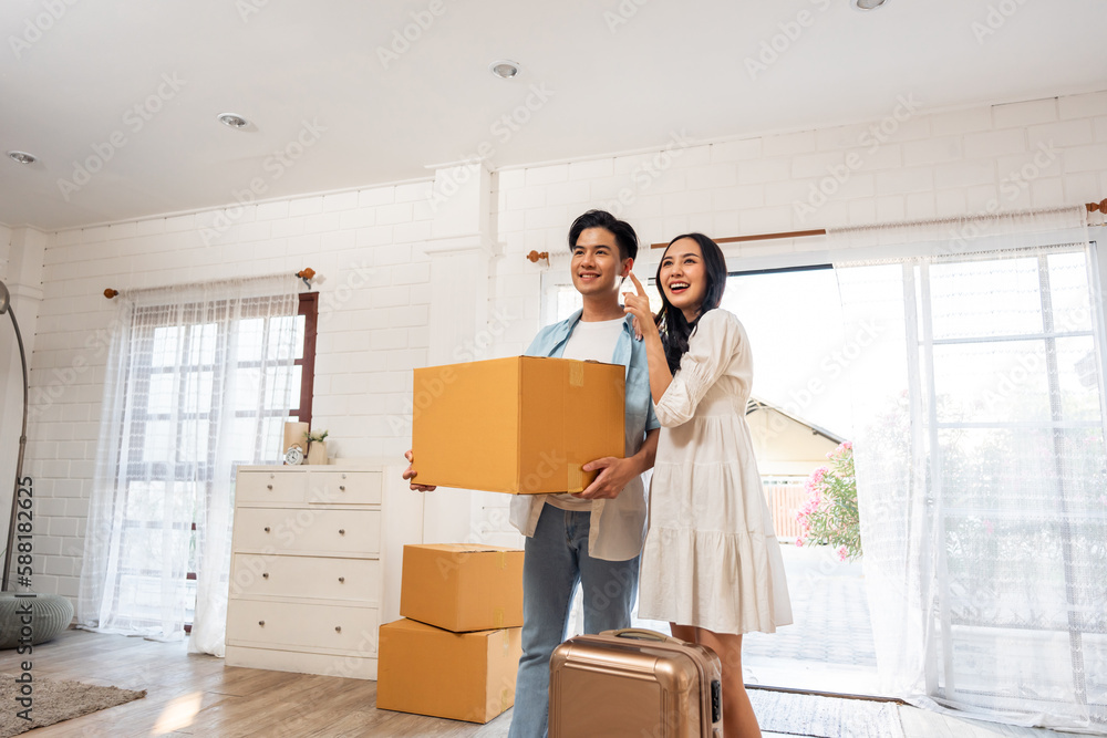 Asian young happy new marriage couple moving to new house together. Asian young happy new marriage couple moving to new house together.