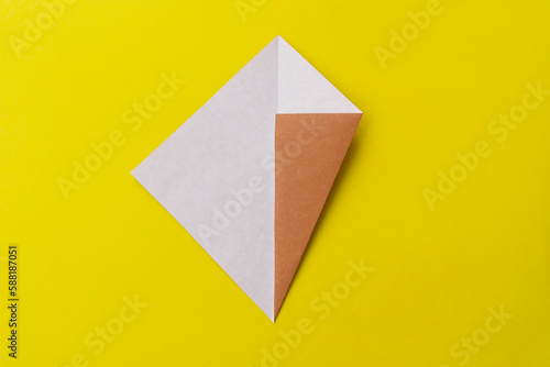 Step by step photo instruction how to make origami big ice cream. Simple diy with kids children's concept. Collage of the steps photo.