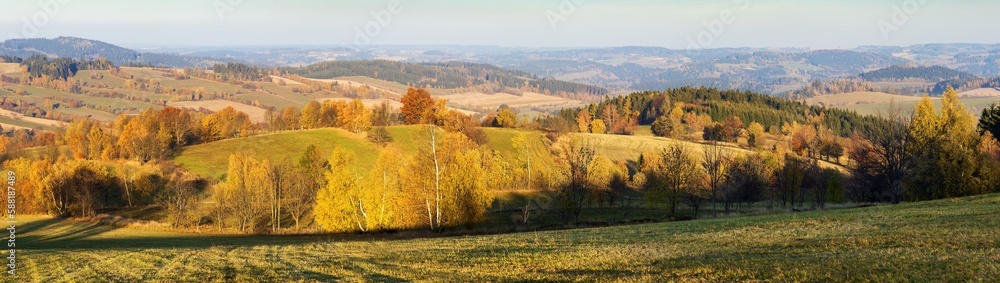 Naklejka premium autumn panorama with meadows fields and forests