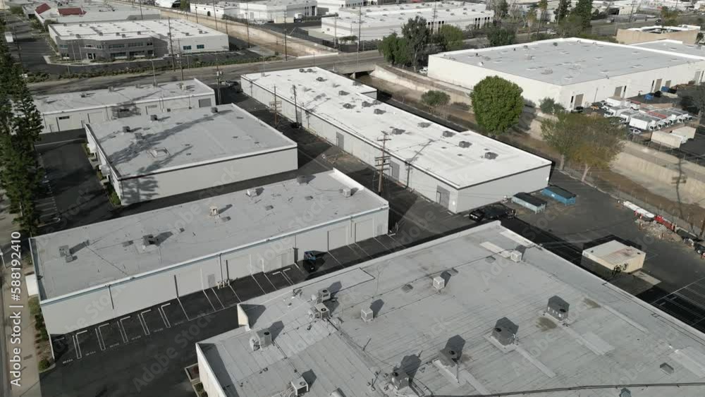 Nondescript warehouse and industrial office buildings are shown in an ...