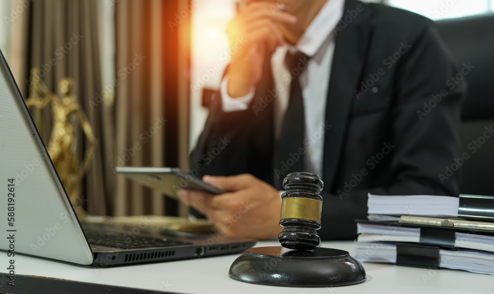 judge on wooden table And experienced lawyers meet with clients and give advice behind the scenes. legal services legal consulting concept judge on wooden table And experienced lawyers meet with clients and give advice behind the scenes. legal services legal consulting concept