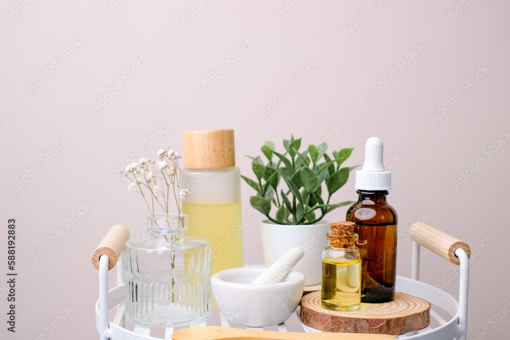the aromatherapy and natural skin care product with flower in the bathroom. Self care and wellness concept the aromatherapy and natural skin care product with flower in the bathroom. Self care and wellness concept