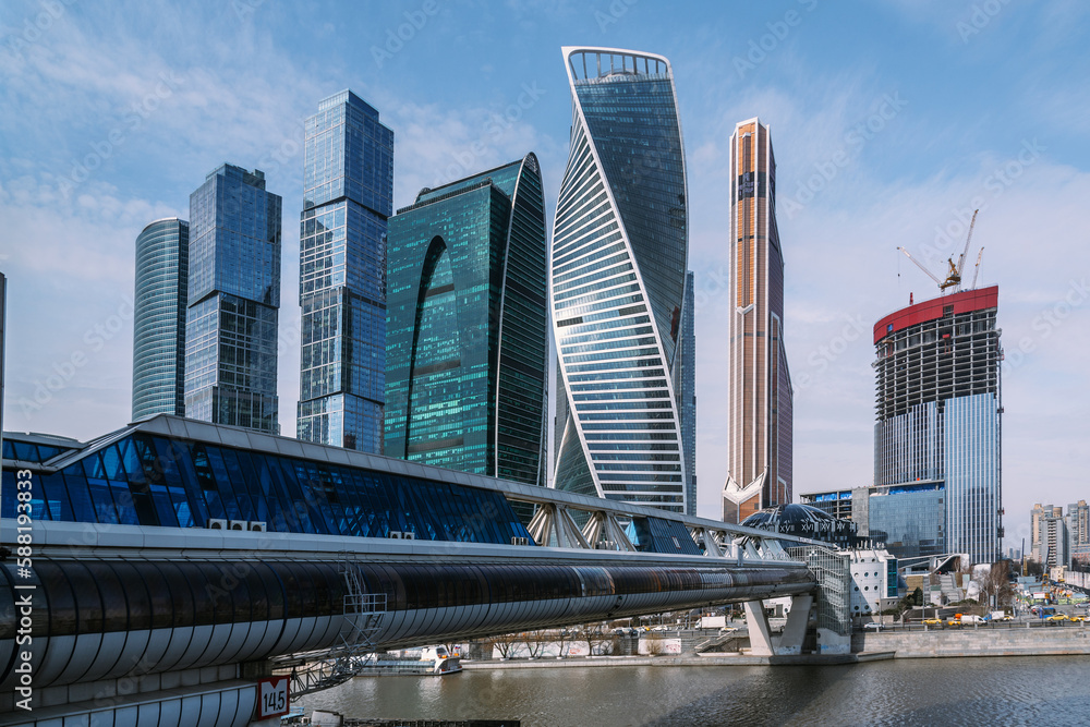 Fototapeta premium Pedestrian Bridge Bagration on Moscow river with skyscrapers Moscow City on the background. Moscow. Russia