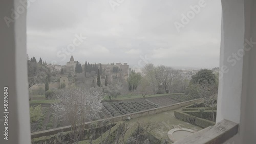 Panoramic view over the gardens of the Alhambra in Granada Spain on a cloudy day from a viewing point on LOG