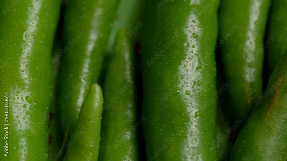Green chili peppers on a wooden chopping board Green chili peppers on a wooden chopping board