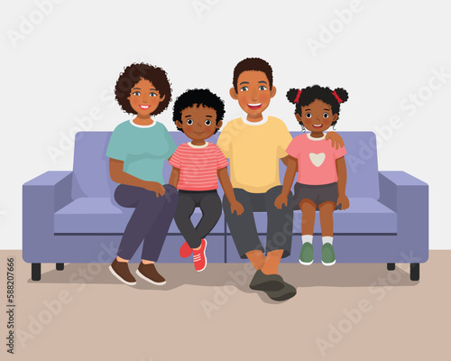 Happy African family sitting on the couch together