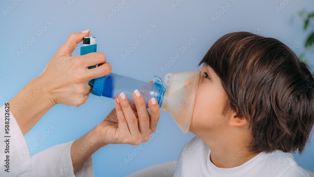 Pulmonologist Helping Little Boy with Aero chamber. Pulmonologist Helping Little Boy with Aero chamber.