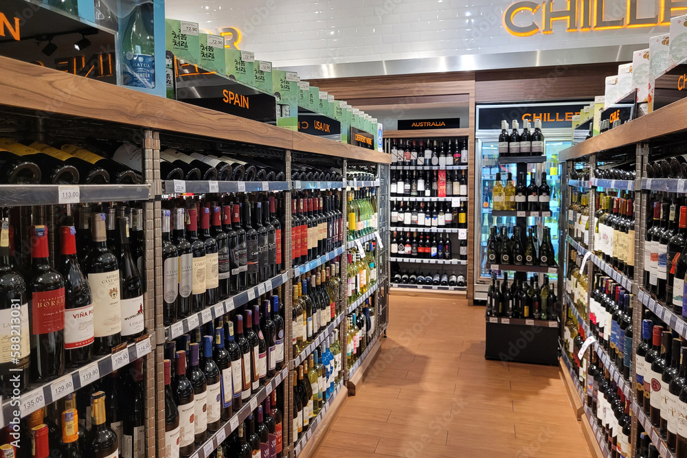 Kuala Lumpur, Malaysia 10 March 2023 An assortment of wine and hard liquor bottles stacked