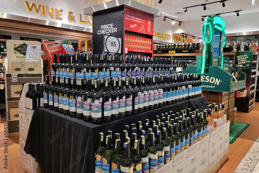 Kuala Lumpur, Malaysia 10 March 2023 An assortment of wine and hard liquor bottles stacked