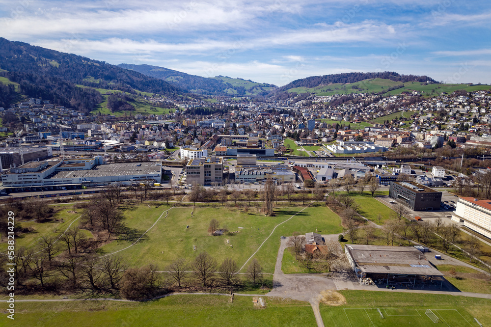 Naklejka premium Aerial view of City of Luzern with City of Kriens in the background on a blue cloudy spring day. Photo taken March 22nd, 2023, Lucerne, Switzerland.