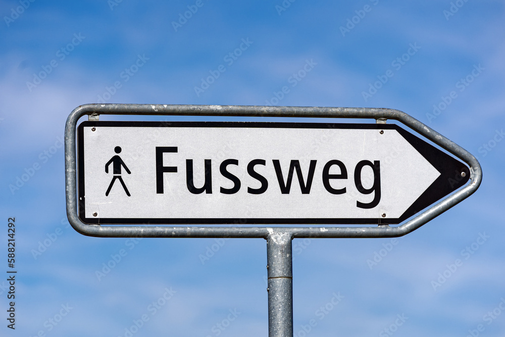 City of Luzern, Canton Luzern, with black and white road sign with text footpath with blue cloudy sky background on a sunny spring day. Photo taken March 22nd, 2023, Lucerne, Switzerland.