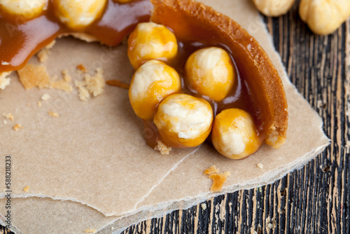 round tartlet with salted caramel and roasted hazelnuts