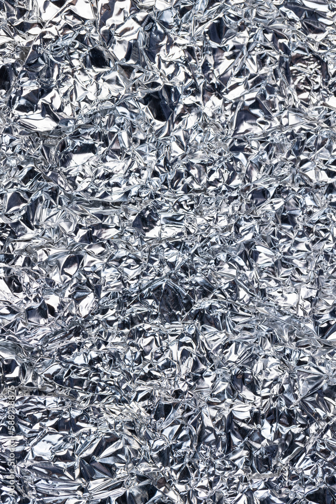 crumpled thin aluminum foil reflecting light crumpled thin aluminum foil reflecting light