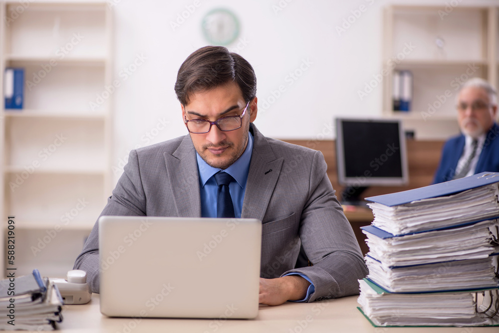 Two male colleagues working in the office Two male colleagues working in the office