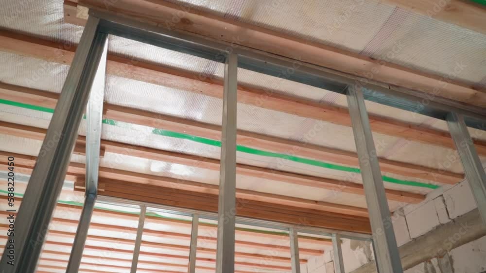 Galvanized steel frame for indoor wall, smooth camera movement. Preparing the frame for drywall Galvanized steel frame for indoor wall, smooth camera movement. Preparing the frame for drywall
