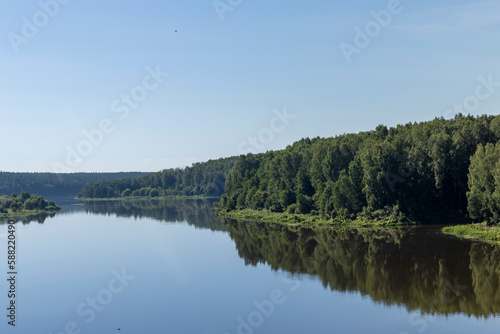 Wide river in summer in sunny weather