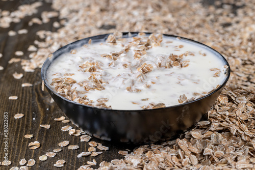 quick breakfast of oat flakes and dairy products photo
