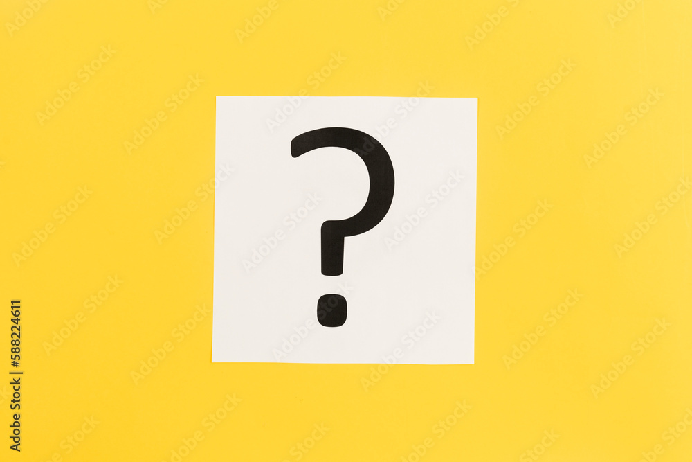 Question mark on white paper on yellow background, flat lay. Question mark on white paper on yellow background, flat lay.