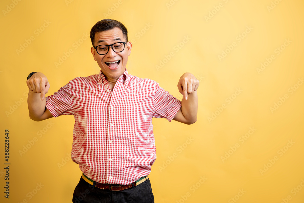 Man with eyeglasses and a shirt pointing at something Man with eyeglasses and a shirt pointing at something