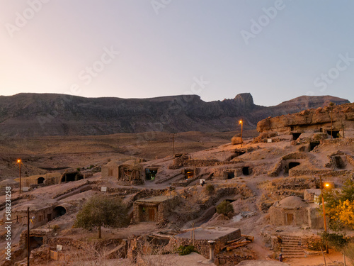 View of the ancient rocky village of Meymand at sunset near Shahr-e Babak city in Kerman Province, Iran