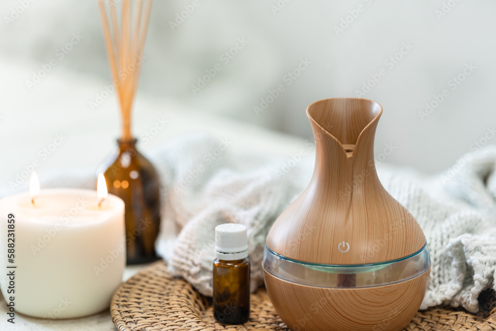 Spa composition with aroma oil diffuser lamp on a blurred background. Spa composition with aroma oil diffuser lamp on a blurred background.